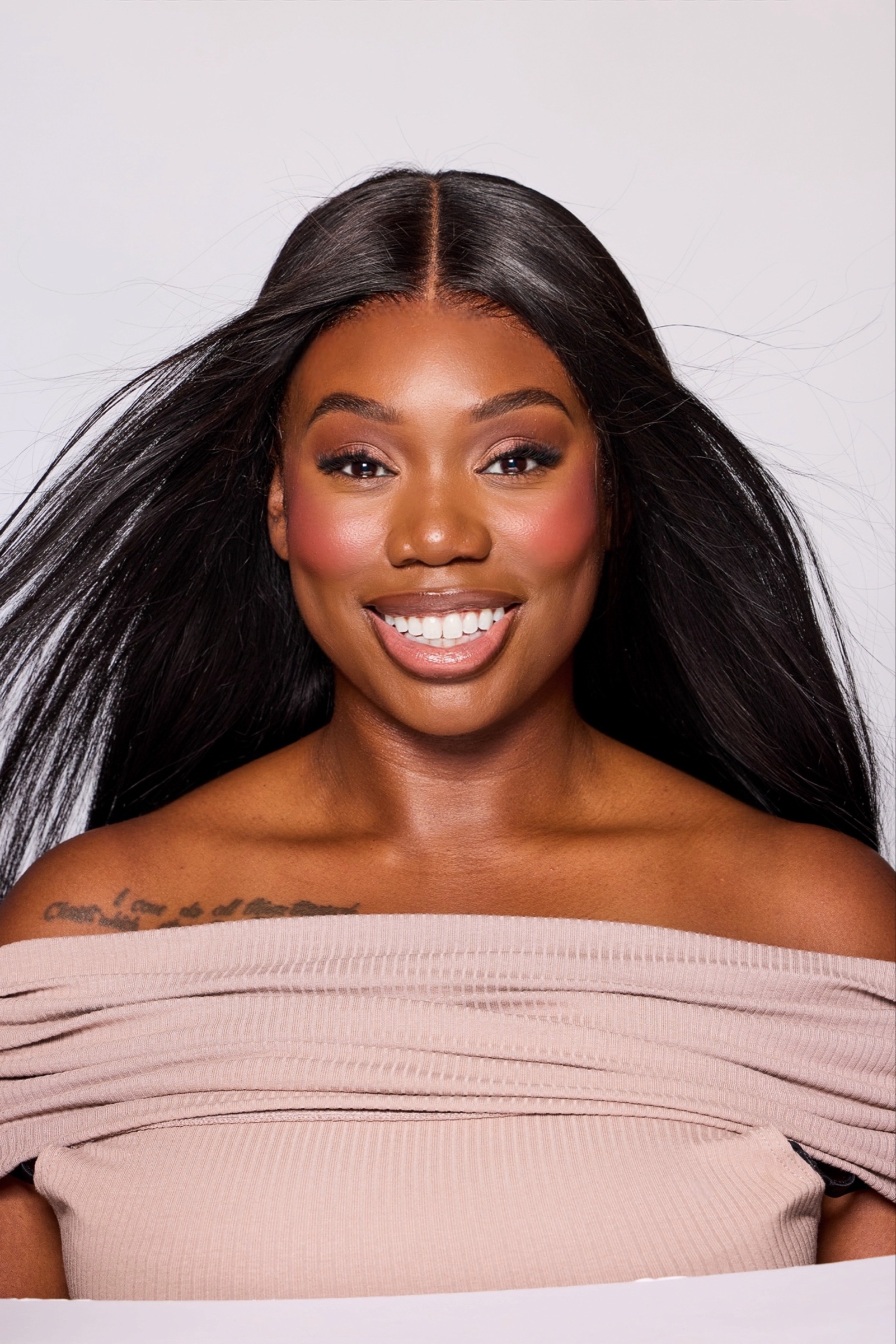 Sweetmara smiling in a polished beauty portrait