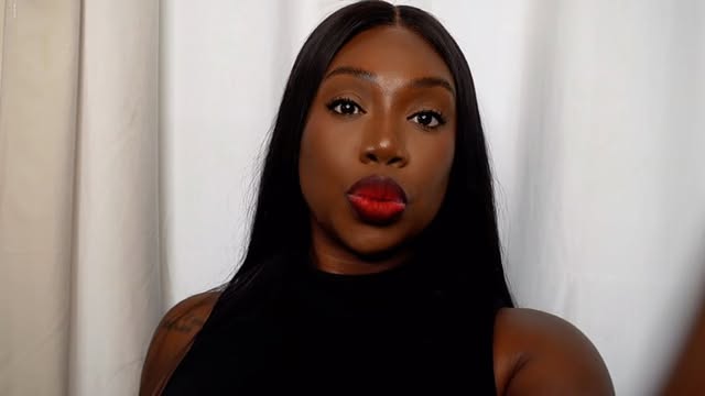 Sweetmara in a classic black look and red lip